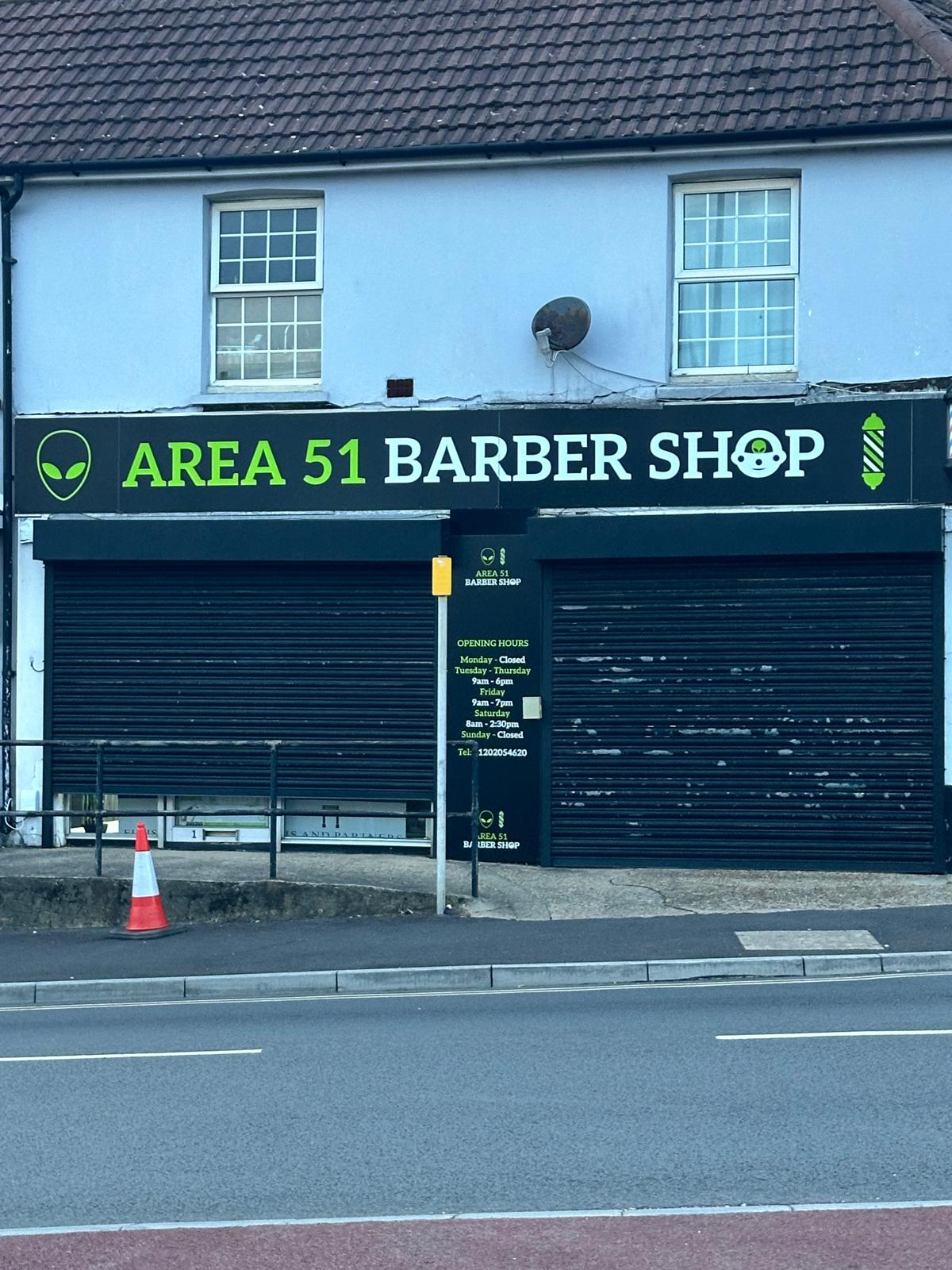 Area 51 Barber Shop, barbers on St Clements Road, Poole BH15: black shopfront with lime green signage